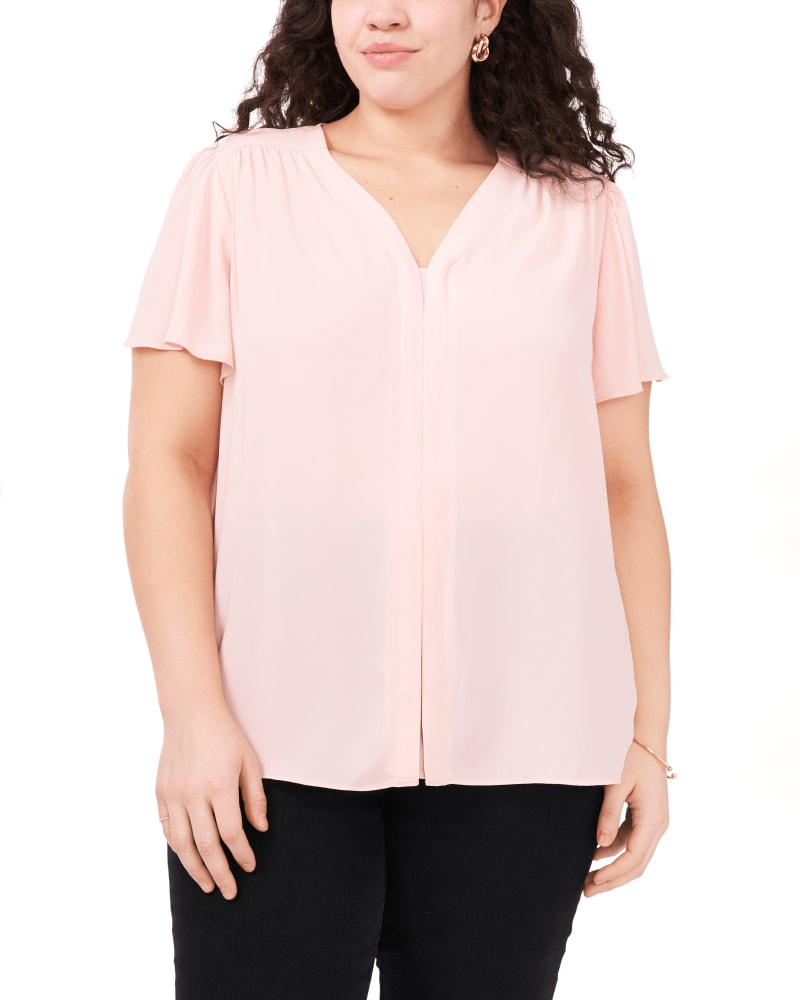 Front of a model wearing a size 1X Violet Flutter Sleeve Blouse in FRESH PINK by Vince Camuto. | dia_product_style_image_id:261788